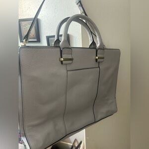 Vince Camuto slender grey purse. Gold accents, includes straps. Used, like new.
